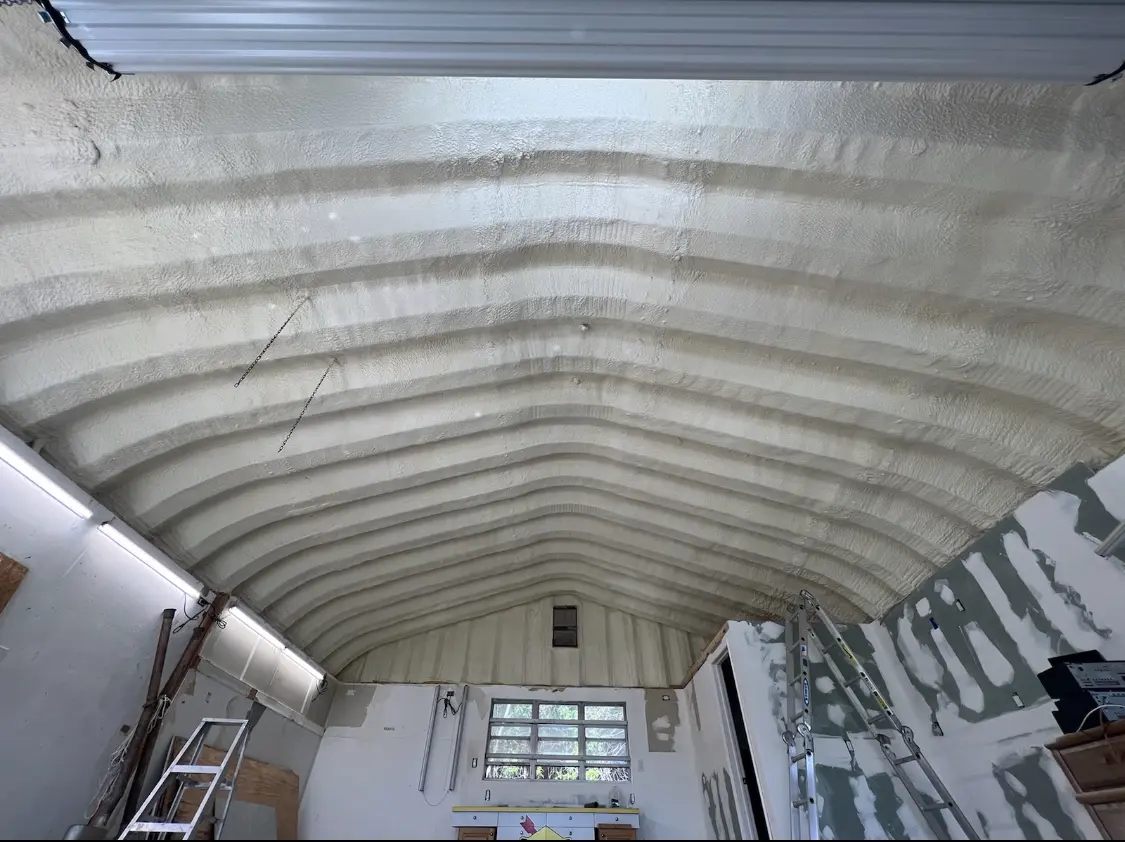 Spray polyurethane foam applied to the underside of a metal roof deck in Boonton